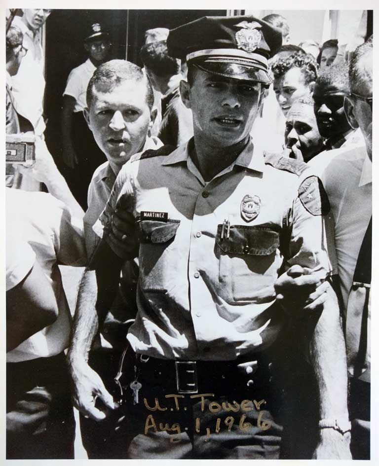 Officer Ramiro Martinez in Austin Police uniform, surrounded by a crowd, August 1, 1966